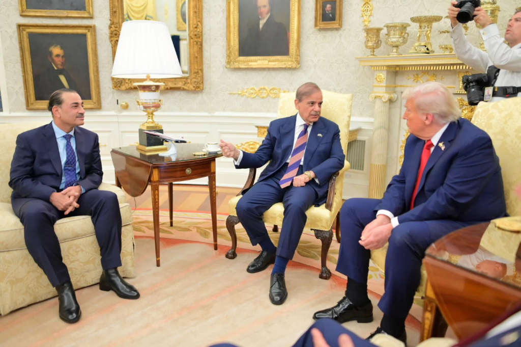Pakistan Prime Minister Shehbaz Sharif speaks during a meeting with US President Donald Trump (right), as Pakistan Army Chief Field Marshal Asim Munir (left) gestures, at the Oval Office in Washington, US, on September 25, 2025.